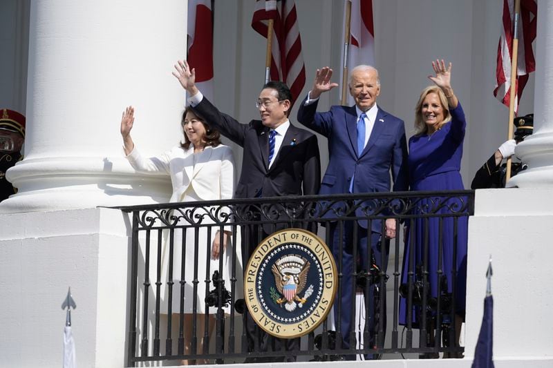 President Joe Biden and first lady Jill Biden, with Japanese Prime Minister Fumio Kishida and his wife Yuko Kishida, wave from the Blue Room Balcony during a State Arrival Ceremony at the White House, Wednesday, April 10, 2024, in Washington. (AP Photo/Alex Brandon)