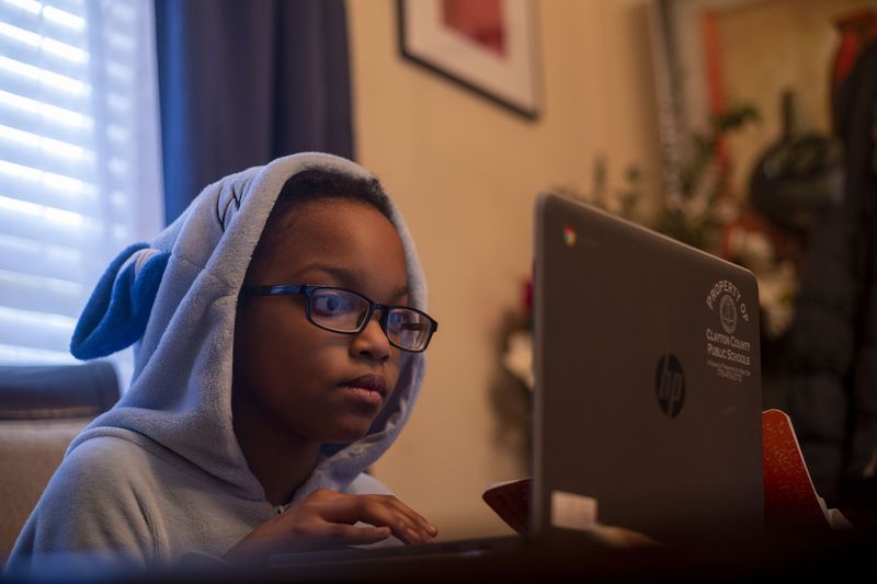 10/12/2020 - Hampton, Georgia - Cayden Dahn, 11, participates in virtual learning at Eddie White Academy at her familyÕs residence in Hampton, Monday, October 12, 2020.  (Alyssa Pointer / Alyssa.Pointer@ajc.com)