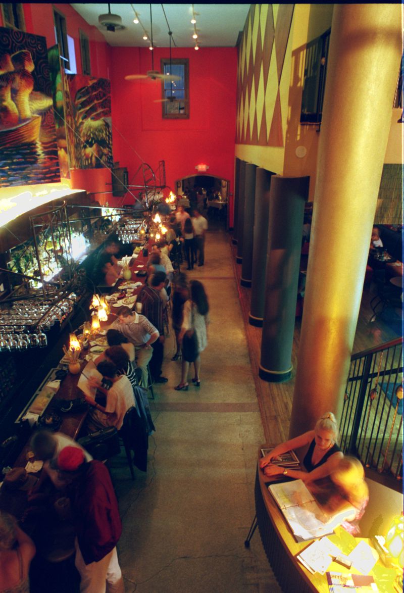 An interior of the dimly lit bar area of Mumbo Jumbo in 1997. / AJC file photo