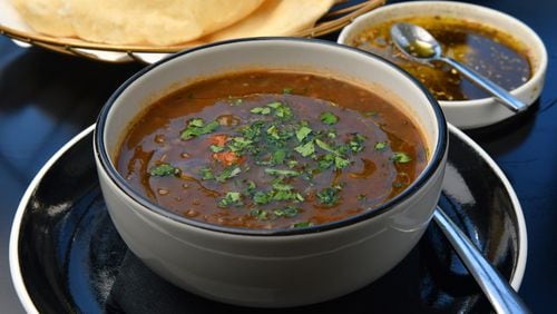 Zakia's Lentil Soup with house-made pita and olive oil with za’atar. (Chris Hunt for The Atlanta Journal-Constitution)