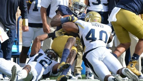 September 19, 2015 South Bend, Indiana - Notre Dame Fighting Irish wide receiver Chris Brown (2) gets double coverage from Georgia Tech Yellow Jackets defensive back Demond Smith (12) and Georgia Tech Yellow Jackets linebacker P.J. Davis (40) in the first half at Notre Dame Stadium in South Bend, Indiana on Saturday, September 19, 2015. HYOSUB SHIN / HSHIN@AJC.COM