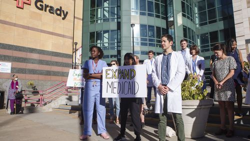 Until recently, health care loomed large over every corner of the political landscape in Georgia for votes. Pictured are health care professionals stand in front of Grady Hospital during a news conference on Sept. 27, 2022. (Christiana Matacotta for the Atlanta Journal-Constitution)