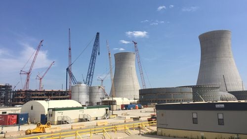 Work on two new reactors at Plant Vogtle is a little less than half-finished. Georgia Power customers now pay about $100 a year in monthly bill surcharges related to the project. The ultimate effect on bills is yet unknown. / jedwards@ajc.com