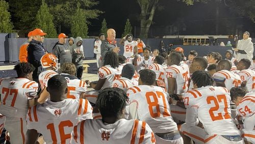 North Cobb head coach Shane Queen addresses him team after the Warriors defeated Marietta 35-9 at Northcutt Stadium to clinch the Region 3-7A championship on Oct. 29, 2021.