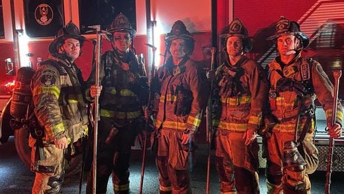 Cobb County fire crews rescued a resident from a house fire in Powder Springs on Tuesday night. Pictured (from left to right) are firefighters Gregory Futch, Adam Jones, Michael Barnett, Jimmy Gregory and Russell Andrews. (Credit: Cobb County Fire and Emergency Services)