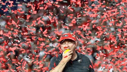 12/31/21 - Miami Gardens - Georgia head coach Kirby Smart takes a bite out of an orange after beating Michigan 34-11 to win the Orange Bowl at Hard Rock Stadium to advance to the national championship game on Friday, Dec. 31, 2021, in Miami Gardens.     Curtis Compton / Curtis.Compton@ajc.com 