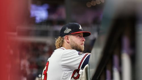 Braves reliever A.J. Minter watches a game against the Reds on April 9 in Atlanta. Minter has surrendered only one run and one hit over 4 ⅔ innings this season. (Branden Camp/for The Atlanta Journal-Constitution)