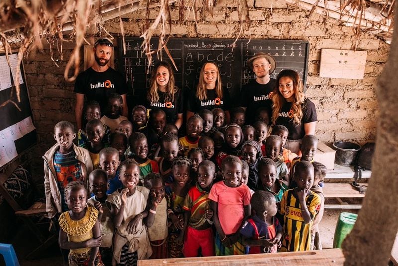 La’Nita Johnson, shown with the village children in Morpougha, Burkina Faso, was there in 2016 to help build a school. (Courtesy of La'Nita Johnson)