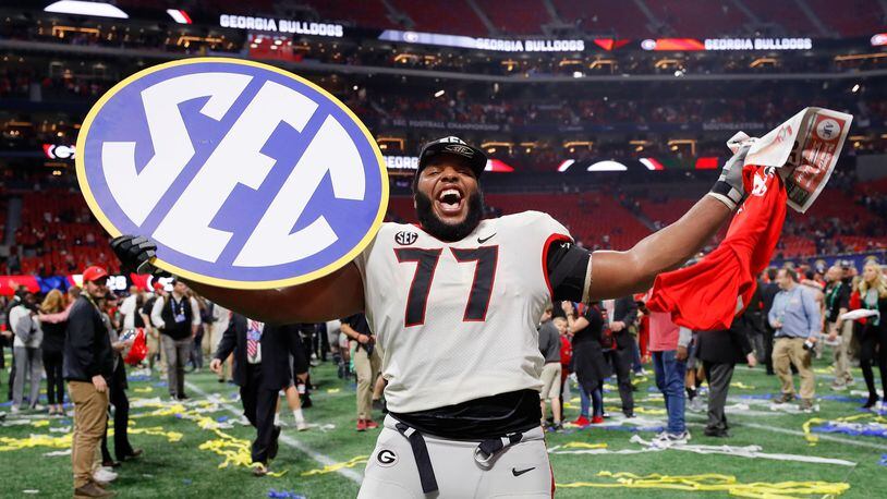 Isaiah Wynn of the Georgia Bulldogs celebrates beating the Auburn Tigers in the SEC Championship at Mercedes-Benz Stadium on December 2, 2017 in Atlanta, Georgia. (Photo by Kevin C.  Cox/Getty Images)