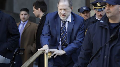 FILE - Harvey Weinstein leaves a Manhattan courthouse after closing arguments in his rape trial in New York, Friday, Feb. 14, 2020. New York's highest court has overturned Harvey Weinstein's 2020 rape conviction and ordered a new trial. (AP Photo/Seth Wenig, File)