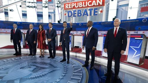 GOP presidential candidates, from left, Doug Burgum, Chris Christie, Nikki Haley, Ron DeSantis, Vivek Ramaswamy, Tim Scott and Mike Pence meet the crowd before the start of the second GOP debate Wednesday at the Ronald Reagan Presidential Library in Simi Valley, Calif. (Myung J. Chun/Los Angeles Times/TNS)