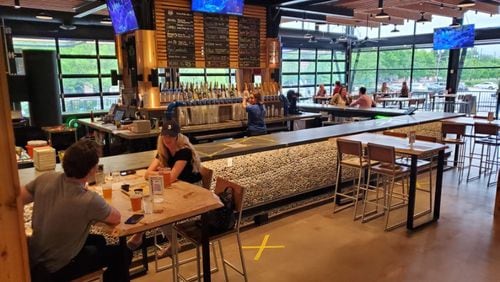 Atlanta’s SweetWater Brewing recently reopened its reconfigured taproom with full-service beer and food available indoors and outdoors. Beer and food are available to go, as well. Courtesy of Sweetwater Brewing Co.