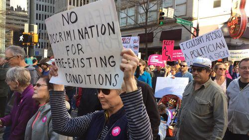 People marched Saturday in Atlanta in opposition to possible repeal of the Affordable Care Act. (Credit: Channel 2 Action News)