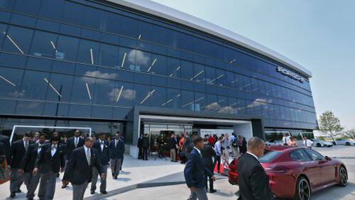 May 7, 2015 - Atlanta - Gov. Nathan Deal and Mayor Kasim Reed joined Matthias Mueller, Chairman of the Executive Board of Porsche, and other Porsche executives as Porsche Cars North America today officially opened its new $100 million Porsche Experience Center (PEC) and headquarters in Atlanta, Georgia. Porsche’s big new presence near the airport boosts the southside area's dreams of becoming an aerotropolis. BOB ANDRES / BANDRES@AJC.COM