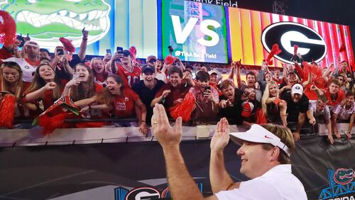 Georgia head coach Kirby Smart celebrates a 36-17 victory over Florida with the fans in the Georgia-Florida NCAA college football game on Saturday, Oct 27, 2018, in Jacksonville.   Curtis Compton/ccompton@ajc.com