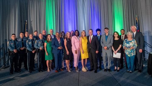 Governor and First Lady Kemp appear with the recipients of the Gwinnett Clean & Beautiful's 2022 ECoS Awards and Scholarships. COURTESY GWINNETT CLEAN & BEAUTIFUL