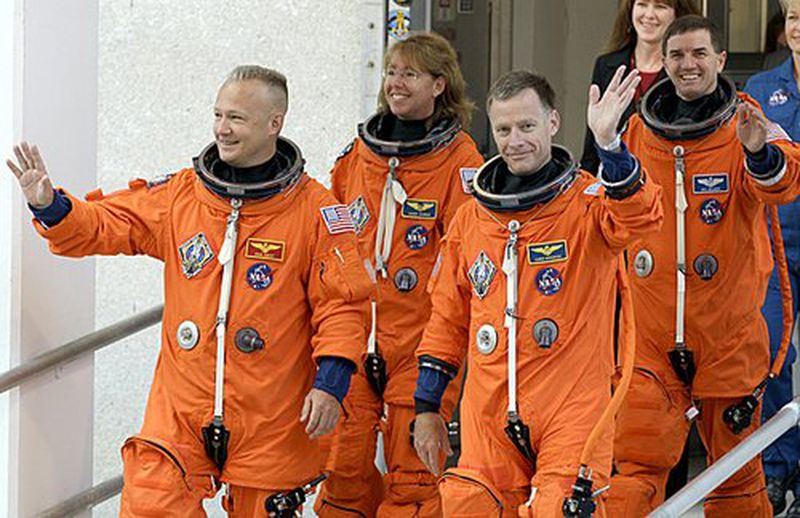 The space shuttle Atlantis astronauts, (left to right) pilot Doug Hurley, mission specialist Sandy Magnus, commander Chris Ferguson and mission specialist Rex Walheim, leave the operations and checkout building on their way to the pad at the Kennedy Space Center Friday, July 8, 2011, in Cape Canaveral, Fla. Atlantis is the 135th and final space shuttle launch for NASA. (Associated Press)