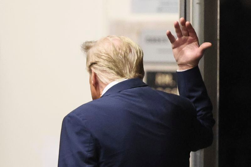 Republican presidential candidate and former President Donald Trump gestures while he walks in Manhattan criminal court in New York, Tuesday, April 23, 2024. (Brendan McDermid/Pool Photo via AP)