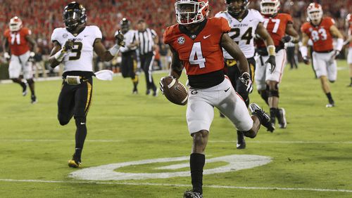 Georgia wide receiver Mecole Hardman runs for a touchdown against Missouri during the first quarter of an NCAA college football game Saturday, Oct. 14, 2017, in Athens, Ga. (Curtis Compton/Atlanta Journal Constitution via AP)