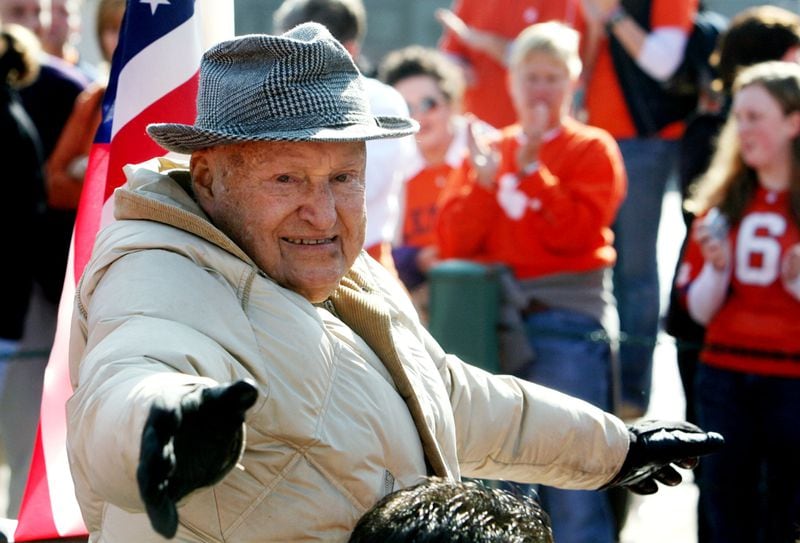 071231 ATLANTA: Grand Marshall Truett Cathy, founder Chick-fil-A, waves to Auburn and Clemson fans as the Chick-fil-A Bowl Parade makes it’s way to the Georgia World Congress Center in Atlanta, Monday, Dec. 31, 2007, as the official kickoff for the game. CURTIS COMPTON / Staff