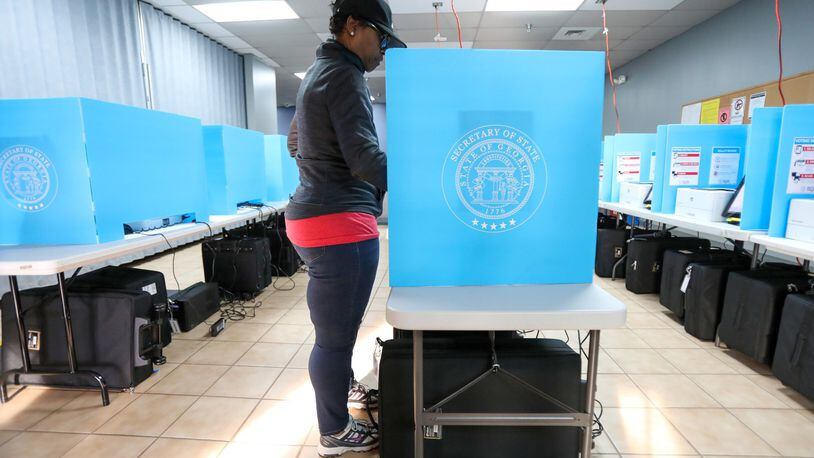 Yolanda Norman of DeKalb County uses te new voting machines at Voter Registration and Elections Office in Atlanta on Monday, March 2, 2020. Miguel Martinez for the Atlanta Journal-Constitution