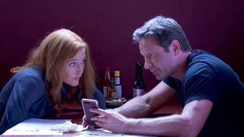 Gillian Anderson and David Duchovny in an episode of the Fox series, “The X-Files.” Contributed by Shane Harvey/Fox