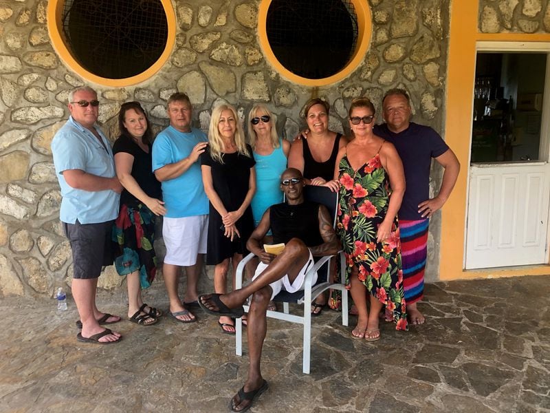 This group of travelers is stuck in Roatan, Honduras after flights were canceled. Left to right: Rick Harmon, Joannie Heath, Gerald Smith, Elisa Smith, Carol Rittenhouse, Wendi Washowich, Sharon Alford and Todd Washowich, with Vernon Alford in front