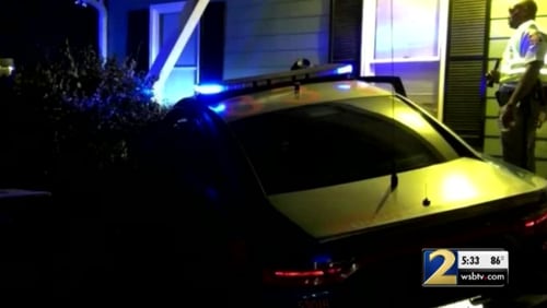 A trooper's patrol car crashed into a house in Winder on Friday night.