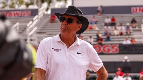 Georgia coach Manuel Diaz watches the Bulldogs compete against Florida on the Henry Feild Stadium courts at the Dan Magill Tennis Complex earlier this season . (Photo by Cassie Baker/UGA Athletics)