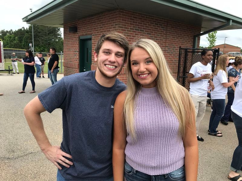  Harley Fuller and Chloe Strickland, two close friends of Caleb Lee Hutchinson, came back to their high school to cheer their friend on at the pep rally. CREDIT: Rodney Ho/rho@ajc.com