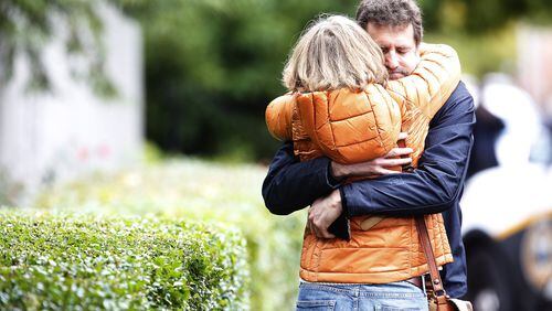 Residents embrace after a mass shooting left at least 10 dead at the Tree of Life synagogue in Pittsburgh’s Squirrel Hill neighborhood, Oct. 27, 2018. (Jared Wickerham/The New York Times)