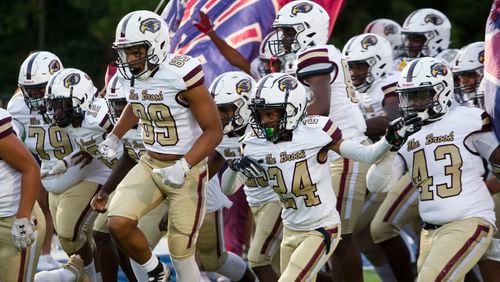 The Pebblebrook Eagles take the field before the Harrison vs. Pebblebrook high school football game on Friday, September 23, 2022, at Harrison high school in Kennesaw, Georgia. Pebblebrook defeated Harrison 31-14. CHRISTINA MATACOTTA FOR THE ATLANTA JOURNAL-CONSTITUTION.