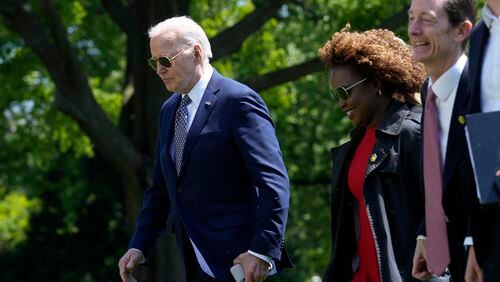 President Joe Biden, from left, walks with White House press secretary Karine Jean-Pierre and White House deputy chief of staff Bruce Reed, as they cross the South Lawn of the White House in Washington, Friday, April 26, 2024, after returning from a trip to New York. (AP Photo/Susan Walsh)