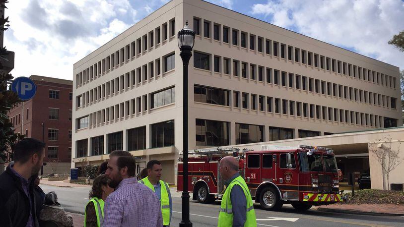 The Cobb County Government building at 100 Cherokee St. was evacuated Tuesday, after a fire started from holiday decorations accidentally lit a blaze, the county said.