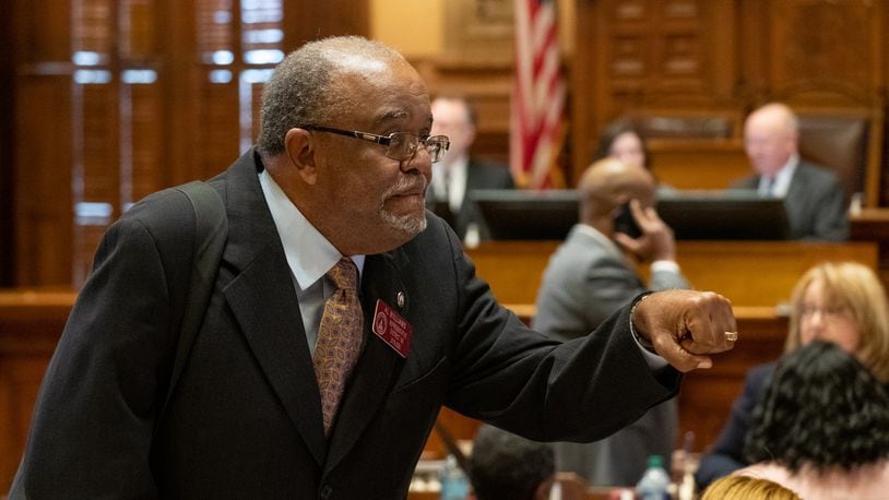 State Rep. Al Williams, D-Midway, goes for a fist bump rather than a handshake Monday at the Georgia Capitol. Ben@BenGray.com for the Atlanta Journal-Constitution