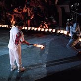Boxing great Muhammad Ali lights the wick to ignite the cauldron during the Opening Ceremonies for the 1996 Olympics in Atlanta. (Cox Staff Photo/Allen Eyestone)