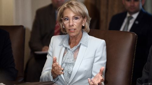 Secretary of Education and school choice champion Betsy DeVos, shown here in July, has made a point of highlighting the success of students leaving public school for private ones. However, a major new study says what makes the key difference is the family resources, regardless of private or public school.