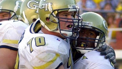 Georgia Tech receiver Will Glover, right, is hugged by offensive lineman Brent Key after scoring on a short pass in the second half of Tech's 40-13 victory over Navy in Atlanta, Saturday, Sept. 16, 2000. (AP Photo/John Bazemore)