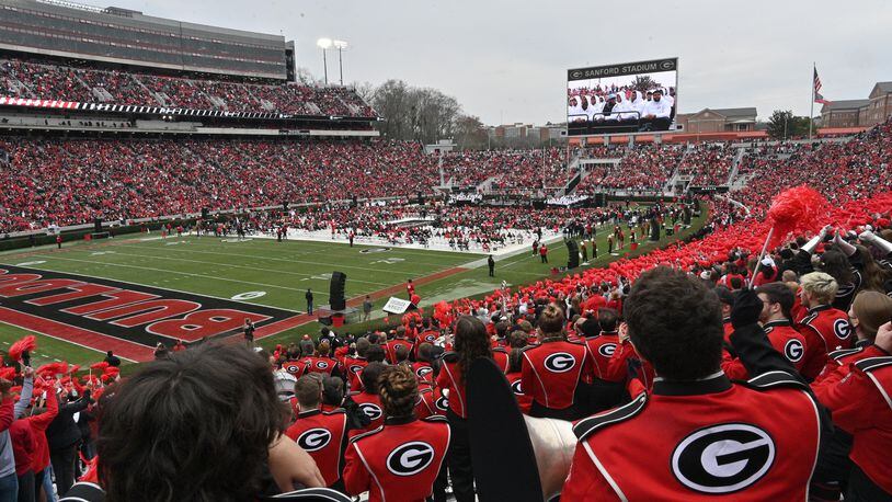 Georgia fans cheer as players take on the stage during the celebration of Georgia’s College Football Playoff national championship at Sanford Stadium in Athens on Saturday, January 15, 2022. Georgia captured the national championship, its first since the 1980 season, with a 33-18 victory over Alabama at Lucas Oil Stadium in Indianapolis. (Hyosub Shin / Hyosub.Shin@ajc.com)