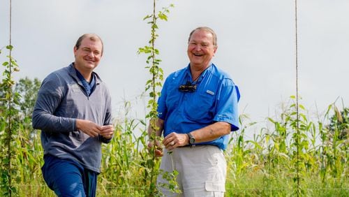Tripp Morgan (left), founder of Pretoria Fields Collective in Albany, works with his father, farm manager Harris Morgan. CONTRIBUTED BY THE LEVEE STUDIOS