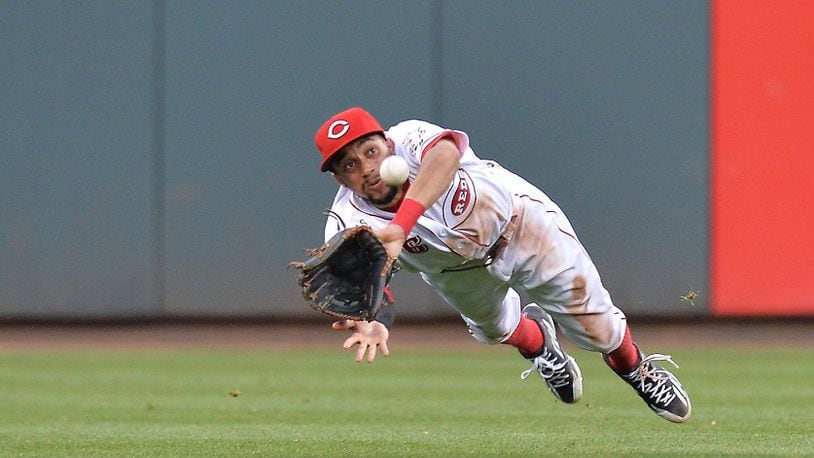 Billy Hamilton  of the Cincinnati Reds makes a diving catch of a line drive  on June 8, 2016 in Cincinnati, Ohio.  (Photo by Jamie Sabau/Getty Images)
