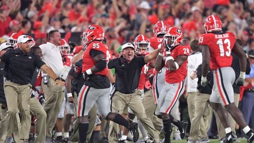 The Georgia Bulldogs and coach Kirby Smart hope to have as much to celebrate at Sanford Stadium this year as they did against Notre Dame last year. (Hyosub Shin / Hyosub.Shin@ajc.com)