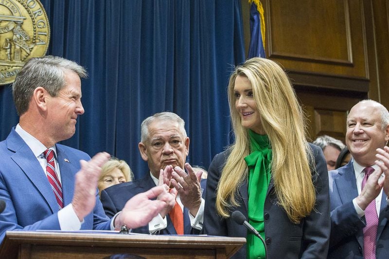 Lawmakers applaud as Kelly Loeffler, second from right, is introduced Dec. 4, 2019, by Gov. Brian Kemp, left, as his choice to succeed U.S. Sen. Johnny Isakson, who is stepping down for health reasons. ALYSSA POINTER / ALYSSA.POINTER@AJC.COM