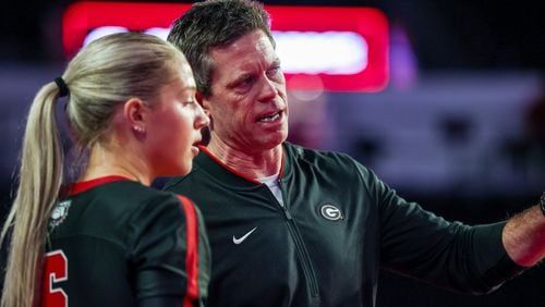Georgia volleyball coach Tom Black offers instructions to Alexa Fortin during the Bulldogs' match earlier this season against Ole Miss. Black recently was named SEC Coach of the Year. (Photo by Tony Walsh/UGA Athletics)