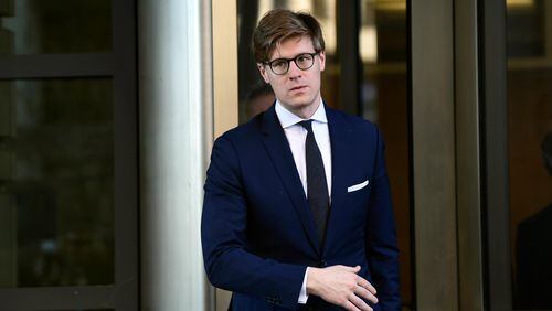 Alex van der Zwaan leaves Federal District Court in Washington, Tuesday, Feb. 20, 2018. Alex van der Zwaan, who worked at the law firm Skadden, Arps, Slate, Meagher & Flom until he was fired last year formally pleaded guilty to a single charge of making false statements. He admitted Tuesday he lied to federal investigators working for special counsel Robert Mueller. (AP Photo/Susan Walsh)