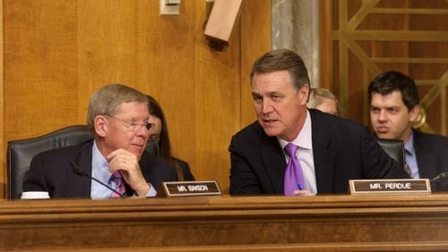 Georgia U.S. Sens. Johnny Isakson (left) and David Perdue (right) at a Foreign Relations Committee hearing on Capitol Hill in June 2015. Courtesy of the Senate Photography office.
