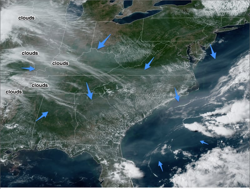 Satellite view from Monday afternoon, with blue arrows  added to point to smoke. From Kirk Mellish blog, News 95.5 and AM 750 WSB
