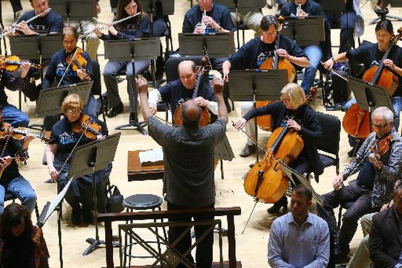 Concertmaster David Coucheron, featured soloist in the Mozart Violin Concerto No 5, and music director Robert Spano during rehearsals for the delayed opening of the Atlanta Symphony Orchestra’s 70th anniversary season on Tuesday. CURTIS COMPTON / CCOMPTON@AJC.COM
