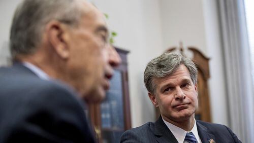 U.S. Sen. Chuck Grassley, R-Iowa, left, speaks to members of the media in his office on Capitol Hill in Washington while Atlanta-based lawyer Christopher Wray, President Donald Trump’s nominee for FBI director, watches. Wray will face a Senate hearing Wednesday concerning his nomination. (AP Photo/Andrew Harnik)