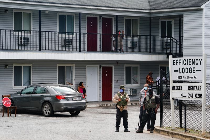 Armed guards are seen on the premises of the Efficiency Lodge on Flat Shoals Road on Wednesday, October 7, 2020, in Panthersville. (Elijah Nouvelage for The Atlanta Journal-Constitution)